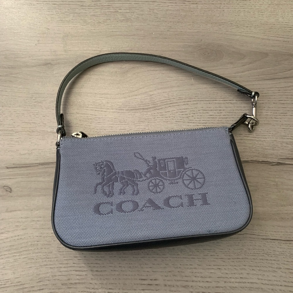 Coach nolita 19 with denim and signature horse and carriage.